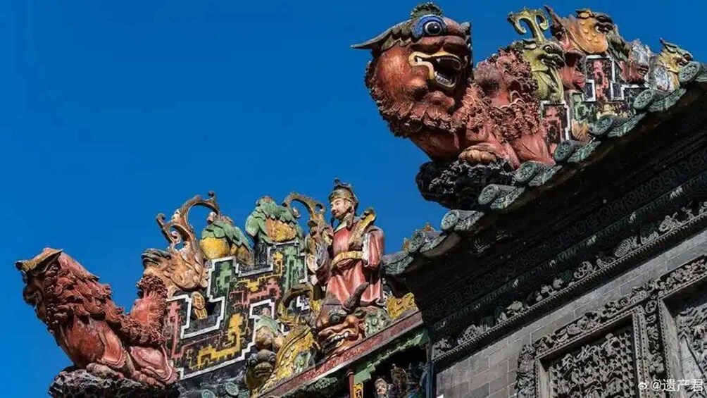 A detailed architectural structure with ornate carvings and statues. 2