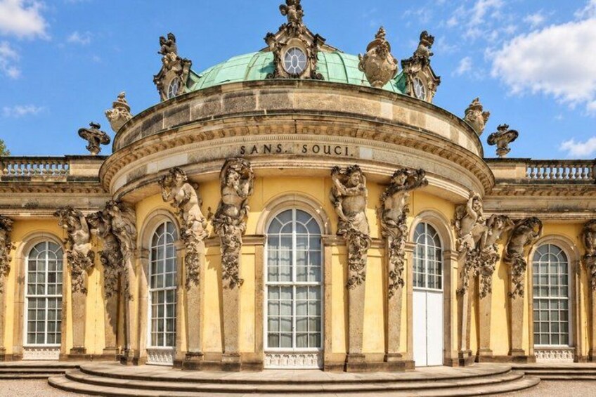 A historic building with ornate sculptures and a dome. 2