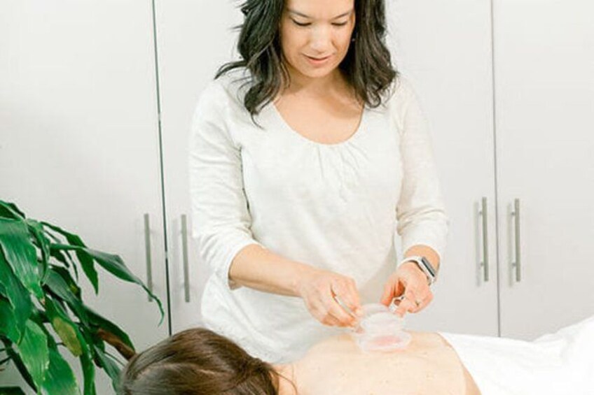 A person receiving a facial treatment with a device on their face. 4