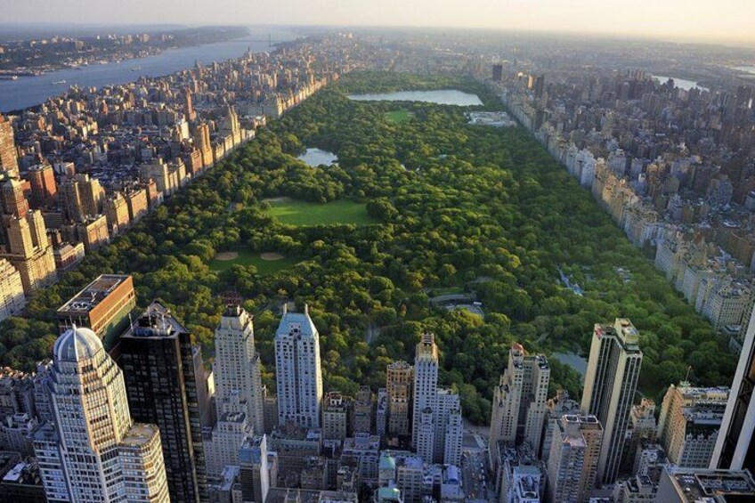 A cityscape with a river, a large park, and high-rise buildings. 2