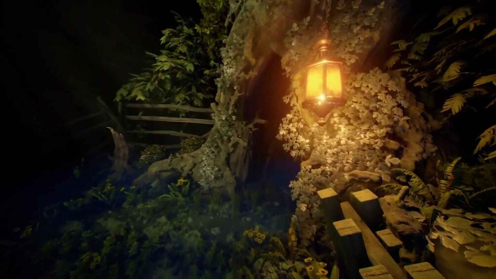 A dimly lit pathway with a lantern, surrounded by dense foliage and a wooden fence. 3