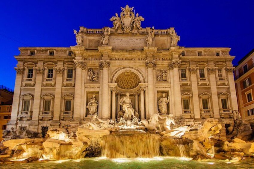 The Trevi Fountain with a nighttime view, featuring the ornate Baroque architecture and the central sculpture of Oceanus. 5