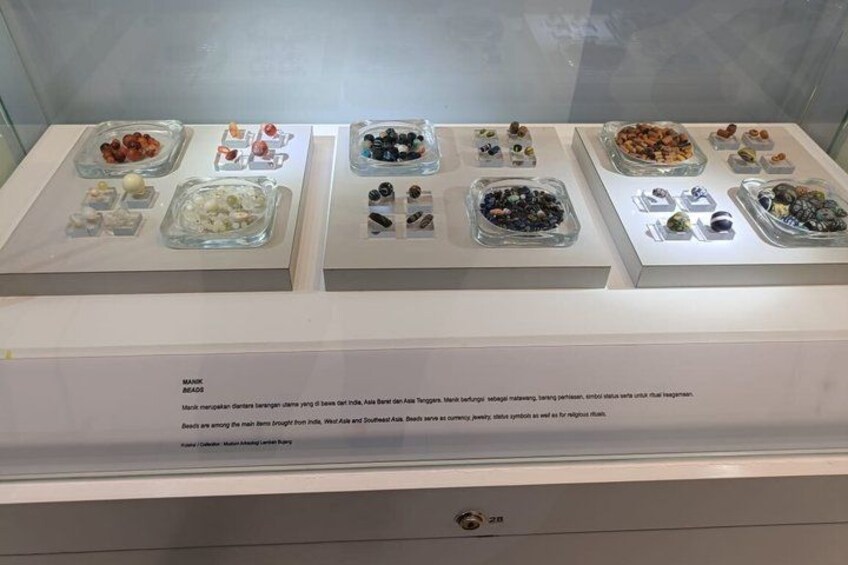 A display of various food items in glass containers. 4