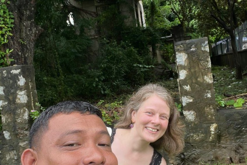 A stone structure with greenery in the background. 4