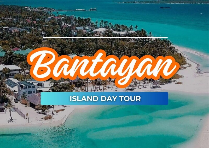 A coastal view of Bantayan Island with clear turquoise waters, a sandy beach, and a small boat. 1