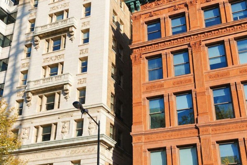 A tall building with classical architectural details, including columns and decorative moldings. 5