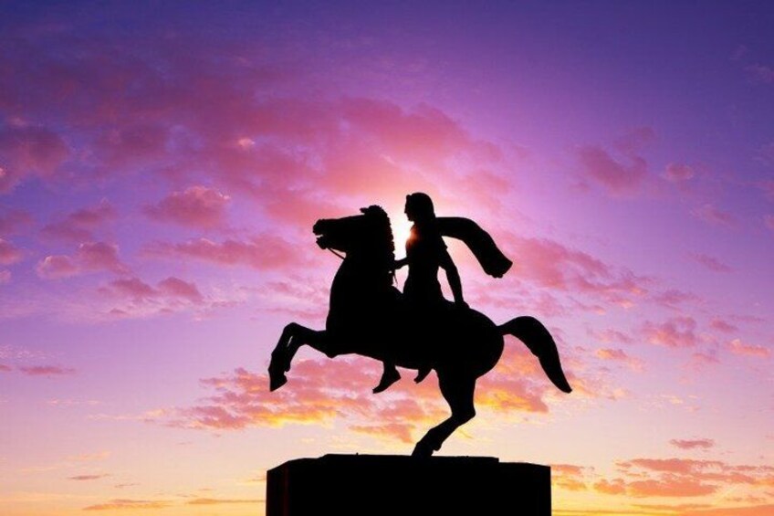 A silhouette of a person riding a horse against a sunset sky. 4