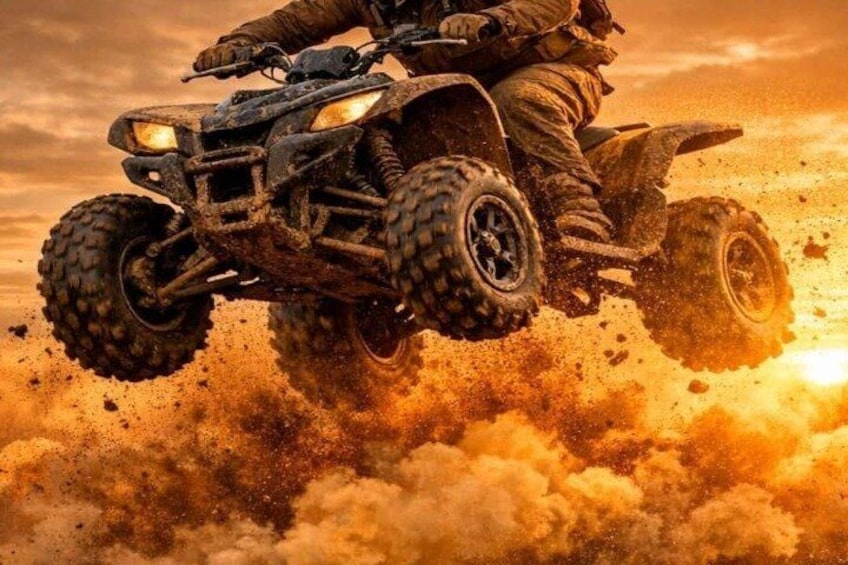A person riding a quad bike in mid-air with a dust cloud below. 1