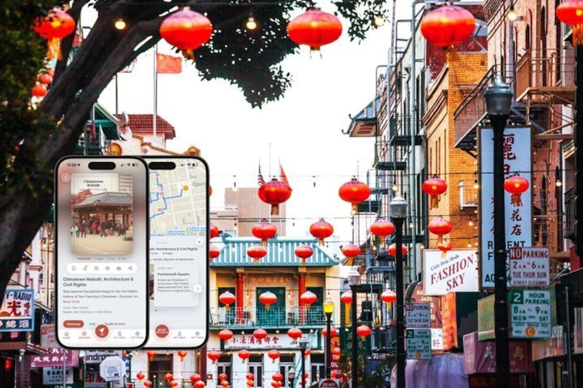A street with red lanterns, traditional architecture, and a smartphone displaying a map. 1