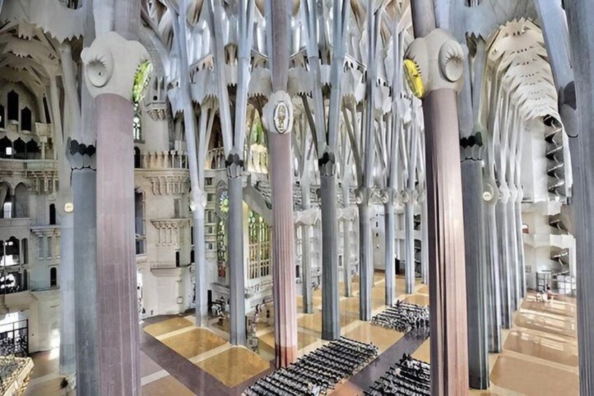 A cathedral interior with intricate Gothic architecture, including pointed arches and ribbed vaults. 4