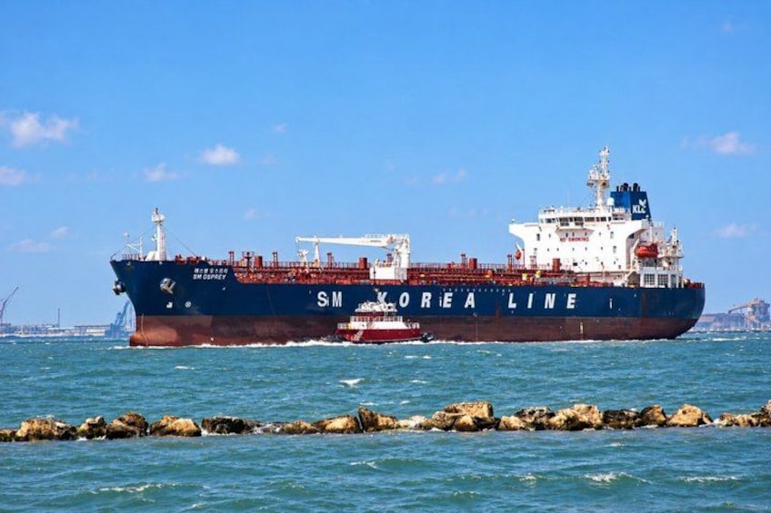 A large cargo ship named 'SM LOREA LINE' sailing on the ocean. 5