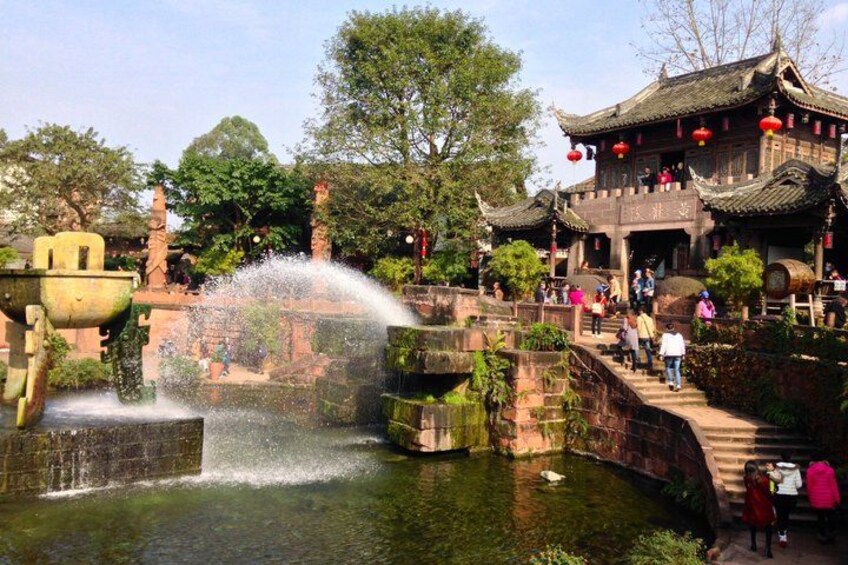 A traditional Chinese building with a water feature in front. 4