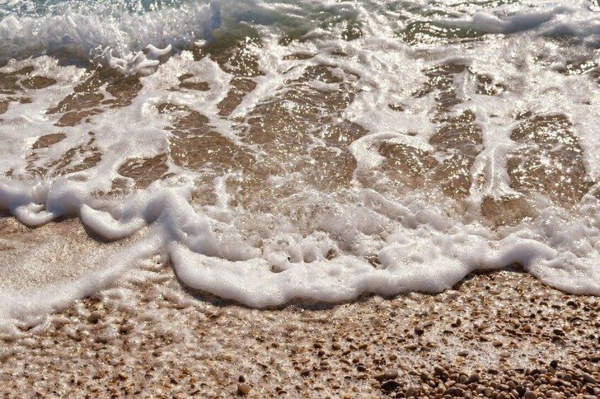Waves breaking on a sandy beach. 3