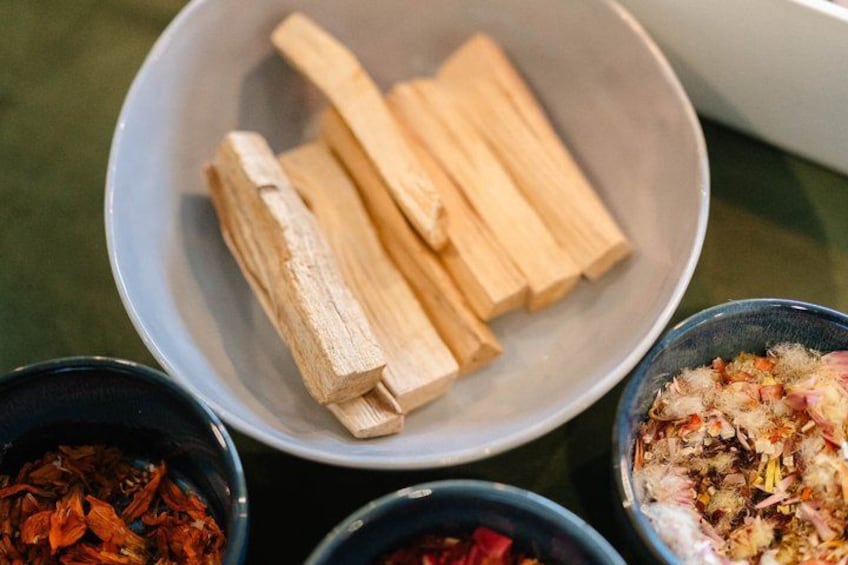 A bowl of dried ingredients, possibly for a recipe, with two smaller bowls containing different spices or herbs. 1