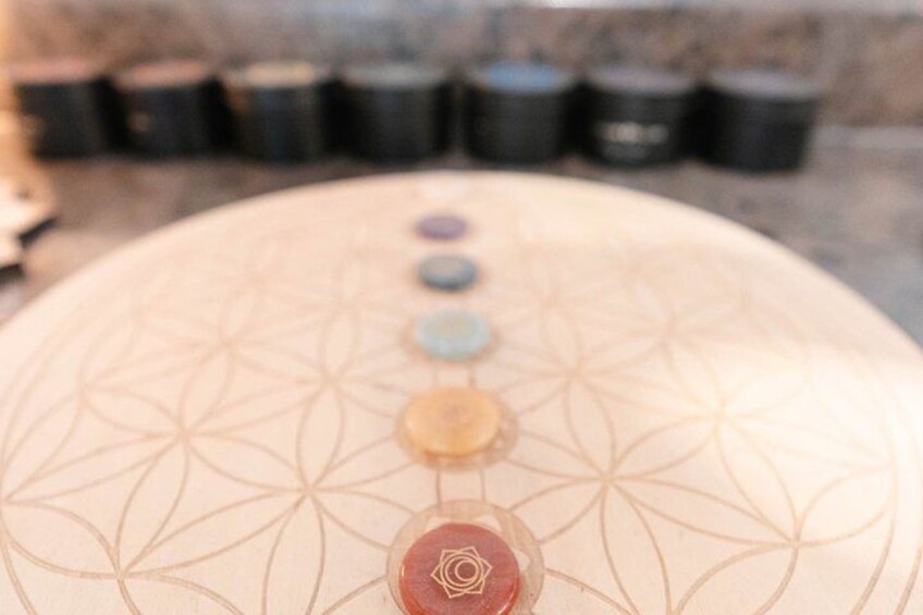 A meditation mat with a geometric pattern and a central symbol. 3