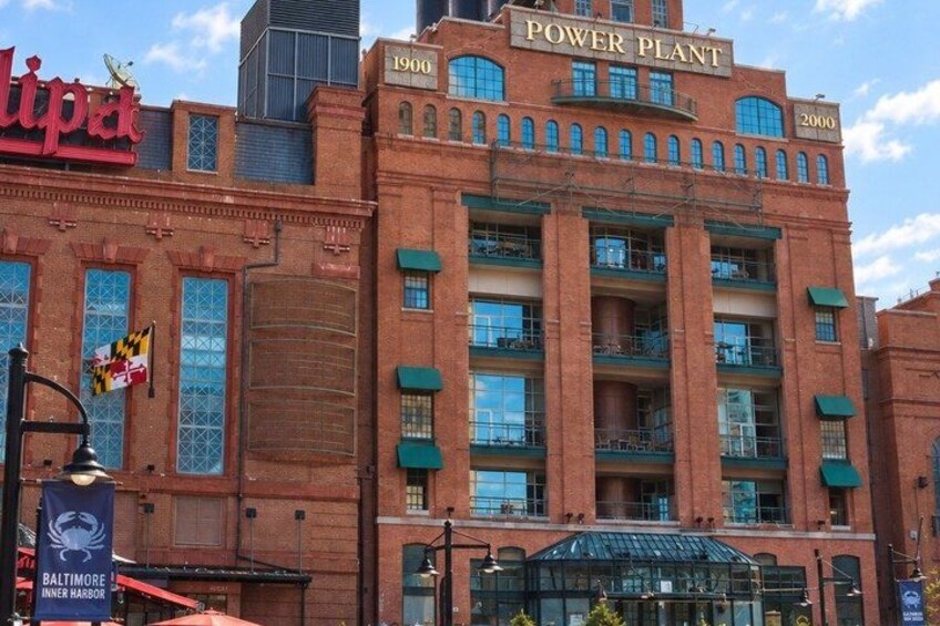 A historic brick building with the sign 'Power Plant' and '1900' on it. 3