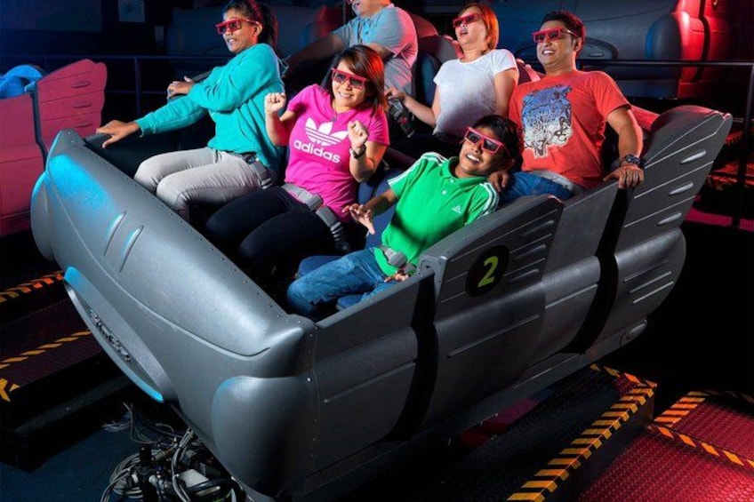 A group of people on a ride with a number 2 sign. 4