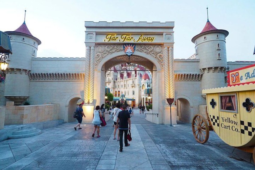 A castle entrance with a sign reading 'Far Far Away' and a yellow cart labeled 'Yellow Cart Co.' 2