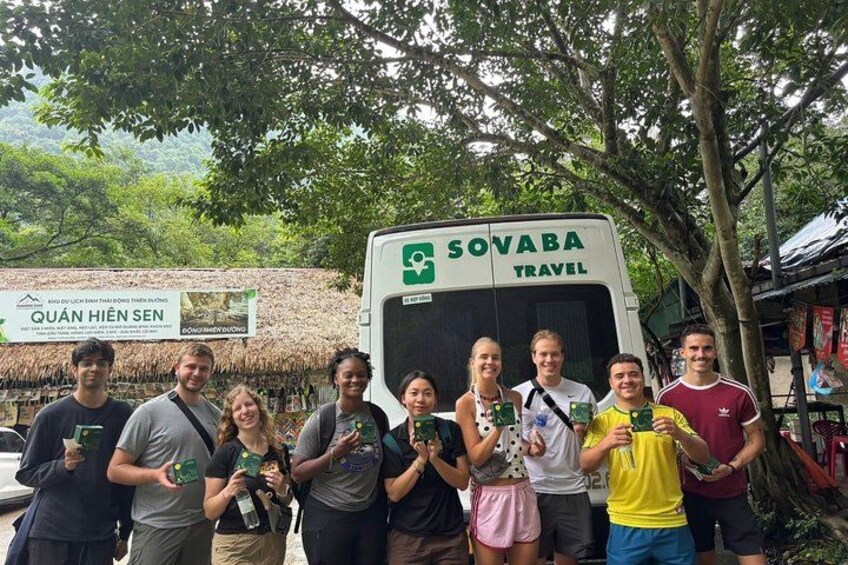 A group of people standing in front of a vehicle with a sign reading 'SOVABA TRAVEL'. 4