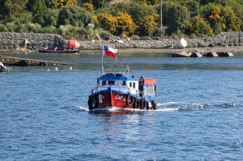 A boat with a flag on the water. 2
