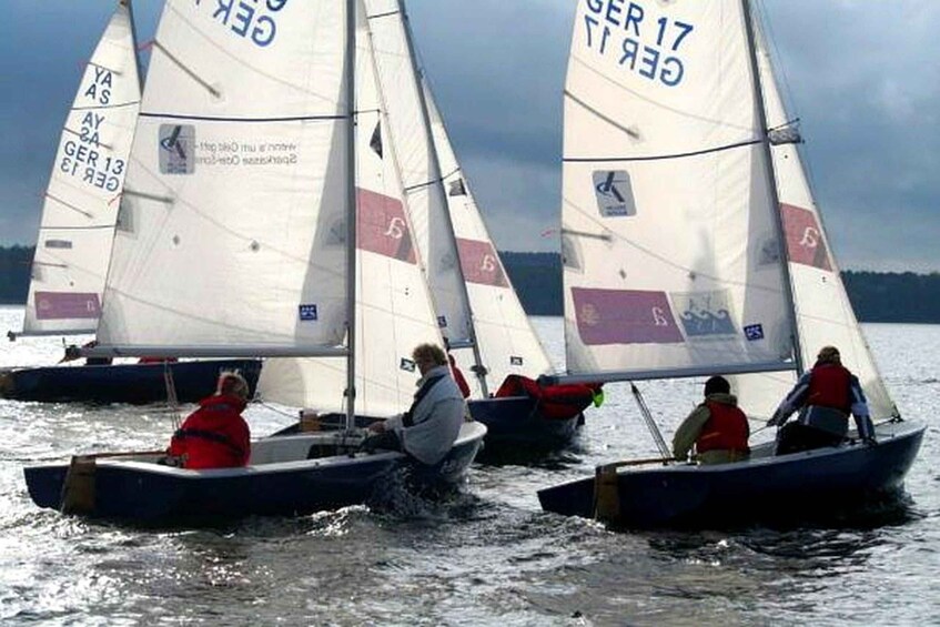 A group of sailboats on a body of water. 5