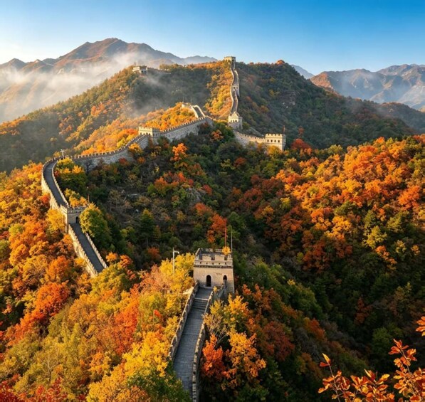 The Great Wall of China winding through a mountainous landscape with autumn foliage. 1
