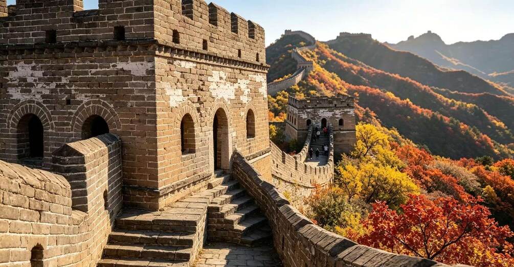 The Great Wall of China with autumn foliage and mountainous terrain in the background. 3