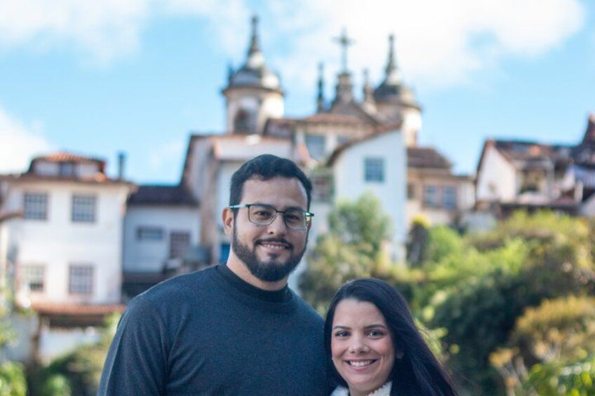 A couple standing in front of a historic building with distinctive architecture. 5