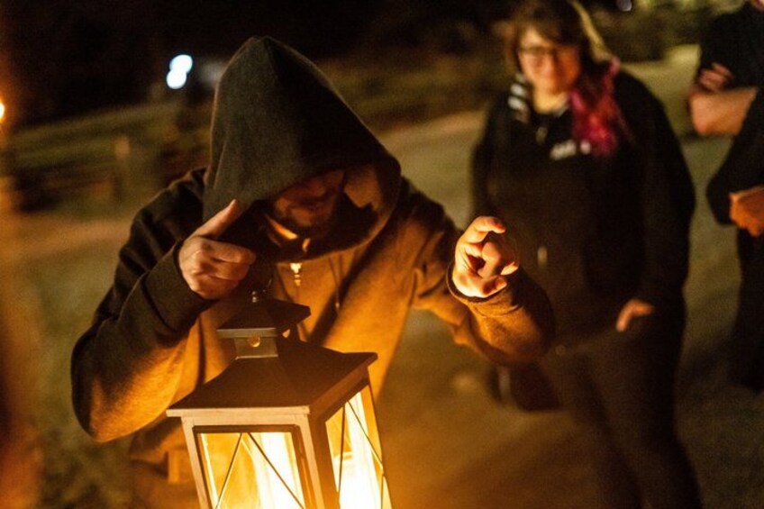 A person holding a lantern. 2