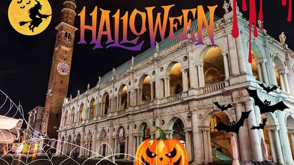 A historic building with arches and a clock tower, decorated for Halloween with pumpkins and bats. 1