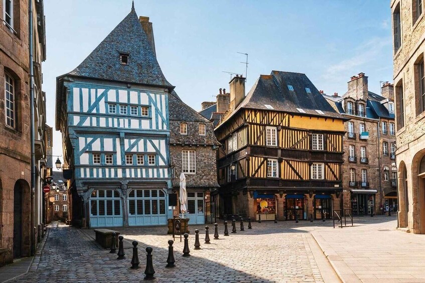 A cobblestone street lined with traditional half-timbered buildings. 5