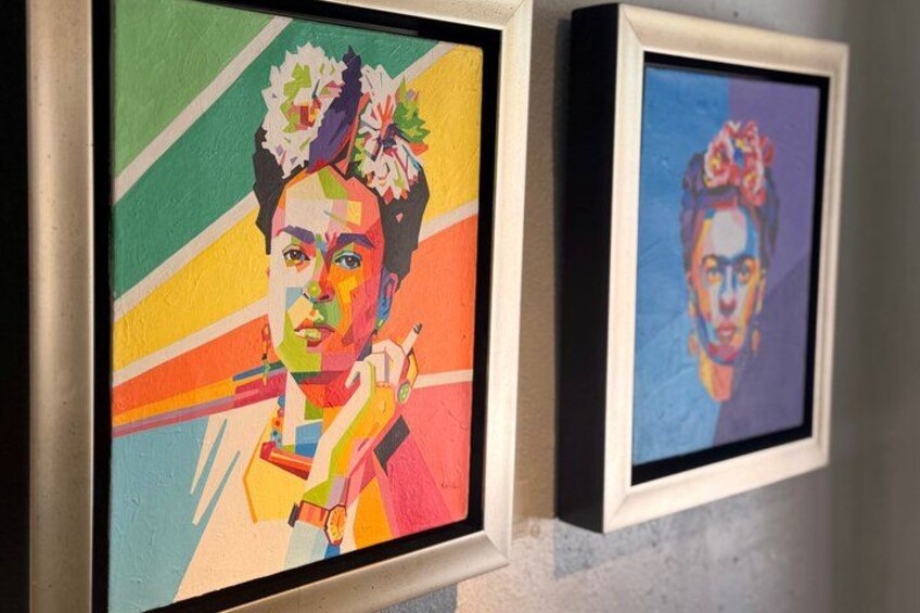 Two framed artworks with vibrant colors and abstract designs. 3