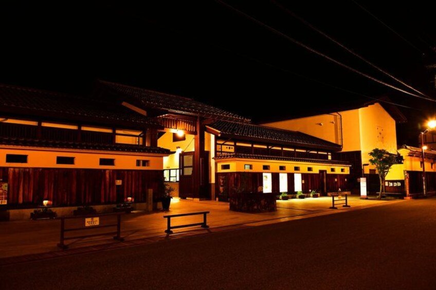 A traditional building at night with warm lighting. 5