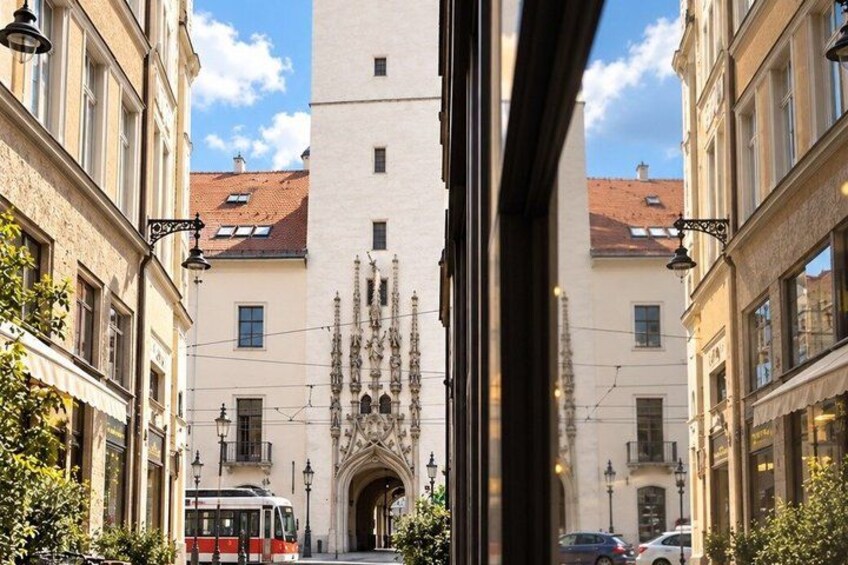 A street with a tram, buildings with ornate facades, and a clear sky. 5