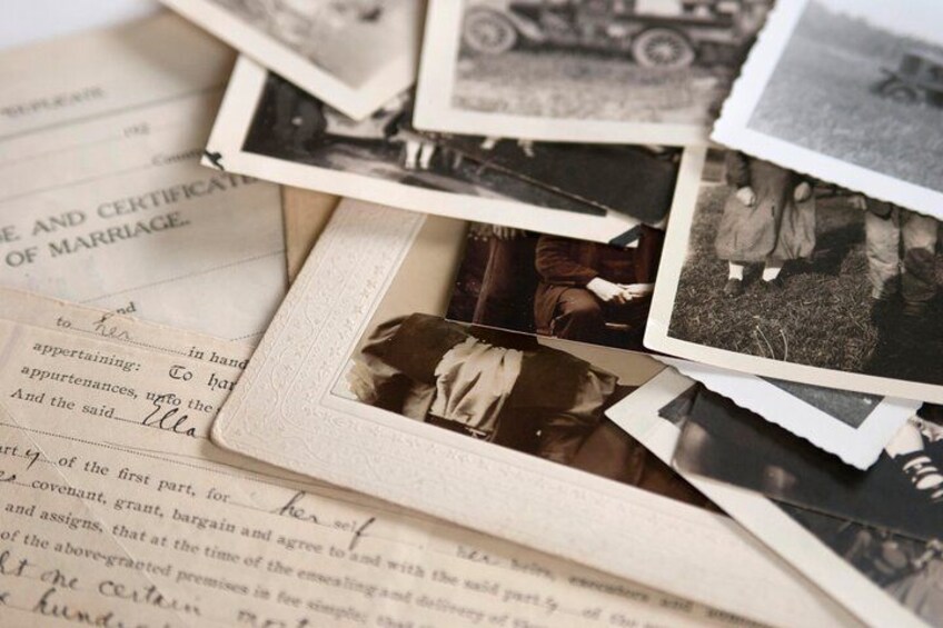 A collection of old photographs and a marriage certificate. 1