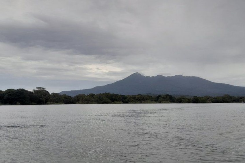 A lake with a mountain in the background. 2