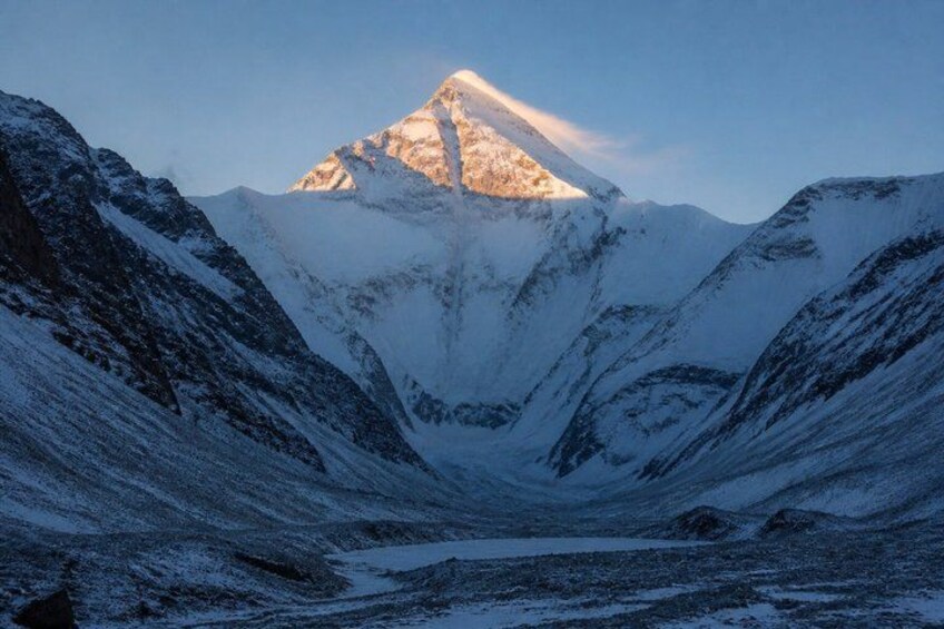 A snow-covered mountain range with a prominent peak. 3
