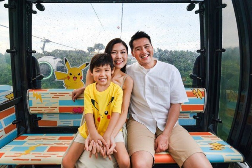 A bus interior with colorful seats and a Pikachu sticker. 4