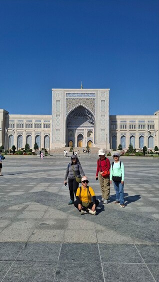 A large, ornate building with intricate tile work and a central archway. 5