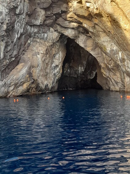 A cave entrance with water flowing into it. 3
