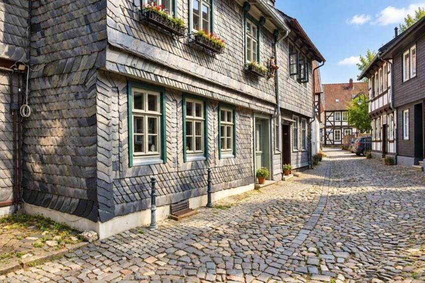 A cobblestone street lined with traditional half-timbered houses. 5