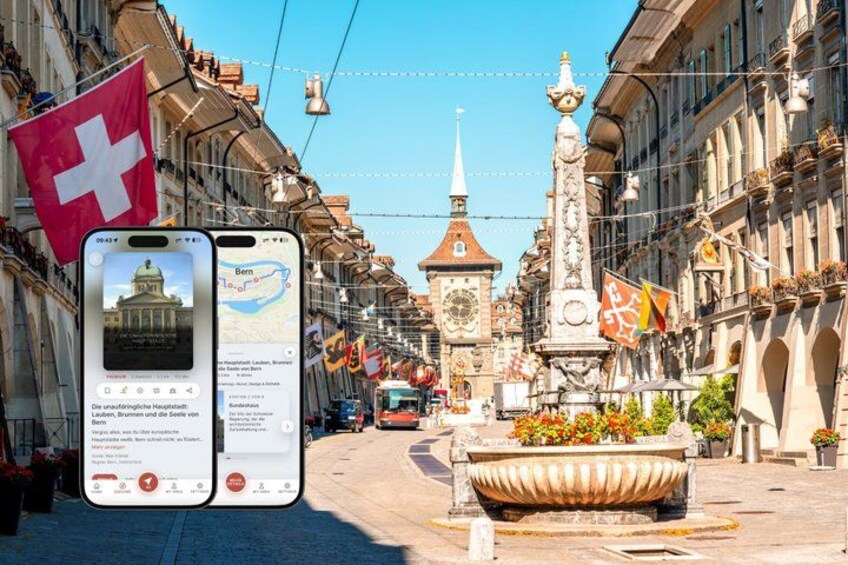 A street with buildings, a fountain, and flags. 1