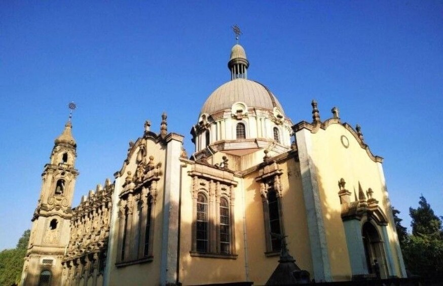 A historic church with a large dome, ornate architecture, and a bell tower. 3