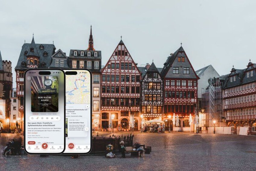 A historic European town square with traditional half-timbered buildings and illuminated street lamps. 1