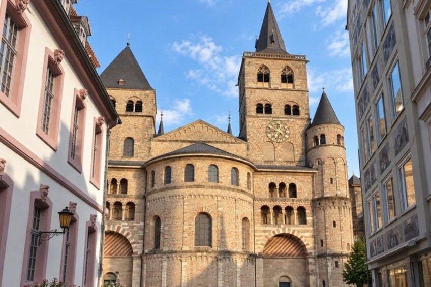 A historic cathedral with a clock tower and arched windows. 5