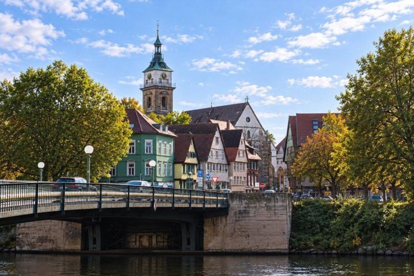 A bridge over a river, historic buildings, and a clock tower. 5