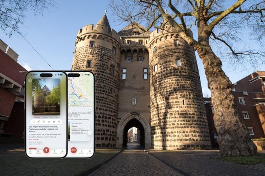 A historic castle with two towers, a cobblestone pathway, and a smartphone displaying a map. 1