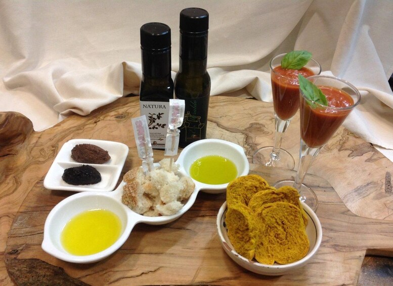 A wooden table with various food items and condiments. 1