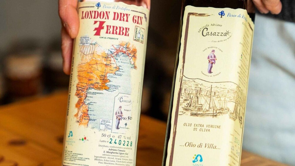 Two bottles of London Dry Gin with labels featuring maps and illustrations. 4