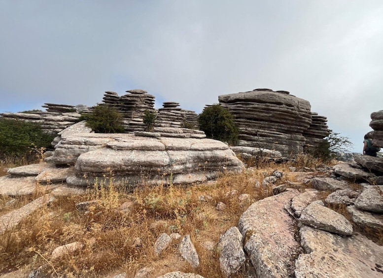 A rocky landscape with layered stone formations. 3